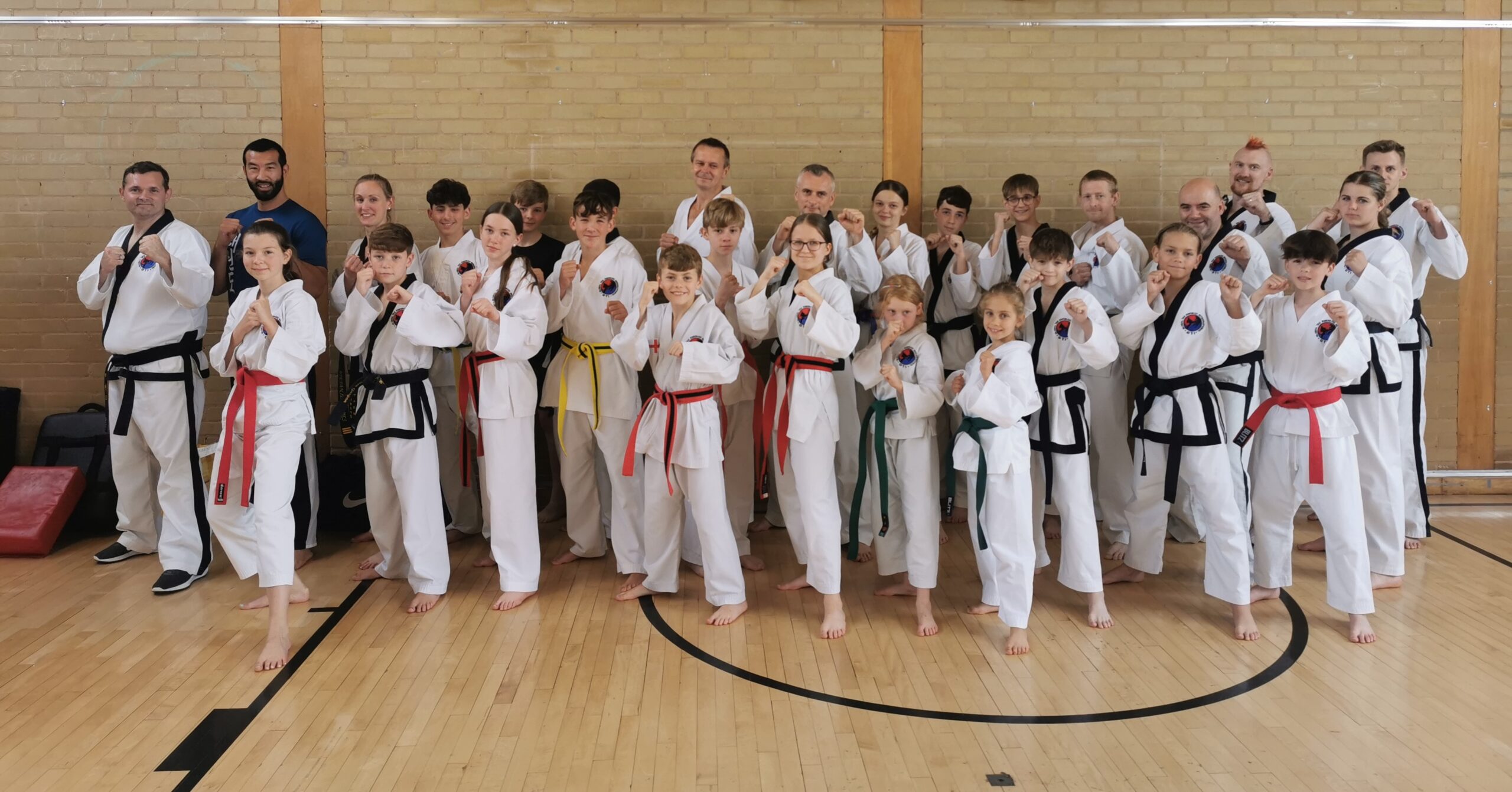 Group photo of Phoenix and GTI members at martial arts seminar