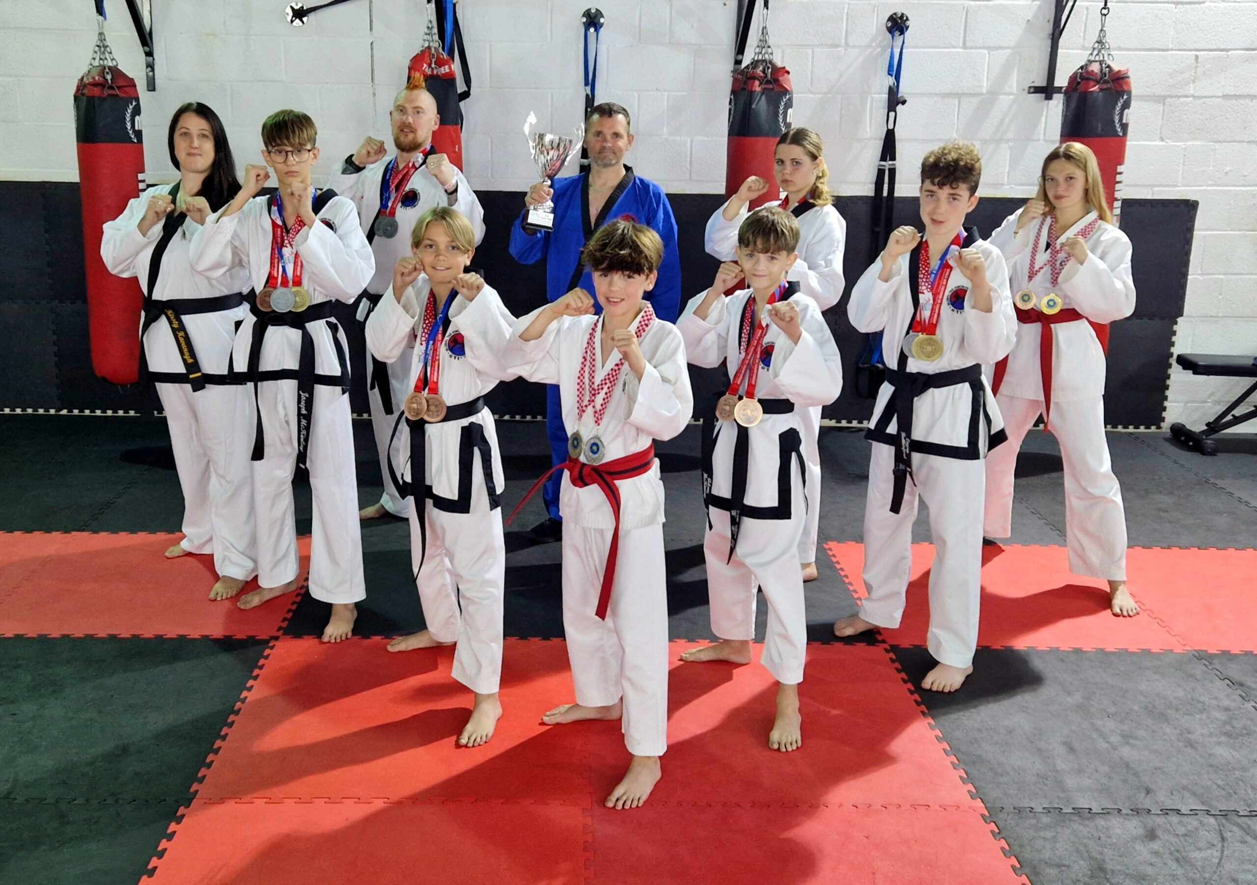 Swindon Taekwondo members showing off their World Championship Medals